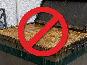 overflowing used cooking oil collection container with a red prohibition symbol highlighting the importance of preventing grease spills at commercial restaurants and kitchens