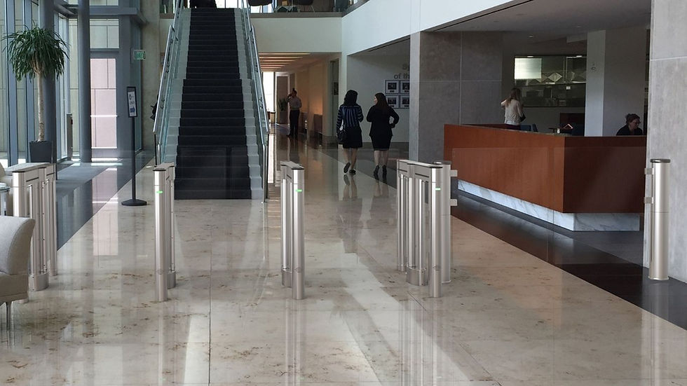 modern office building lobby featuring optical turnstiles with glass barriers for secure access control and tailgating prevention