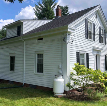 finished exterior painting of white cape house with aluminum siding in Windsor/Manchester CT