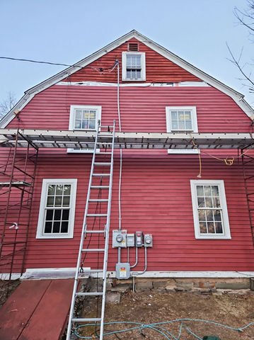 In progress of installation of new cedar siding on historic home in Vernon CT