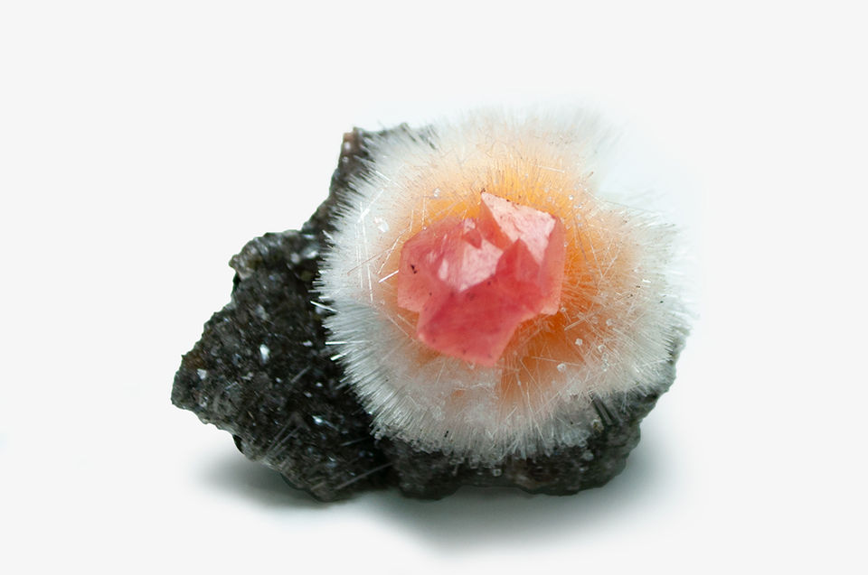 3.6 centimeter red calcite on mesolite 