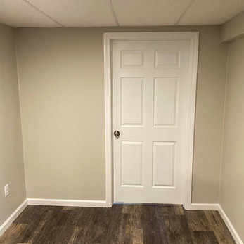 finished new drywall wall, door and trim interior basement remodel painting in Glastonbury CT