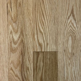 Close-up of Dubeau Natural Red Oak Nuance prefinished hardwood flooring showcasing smooth matte finish and distinct wood grain pattern