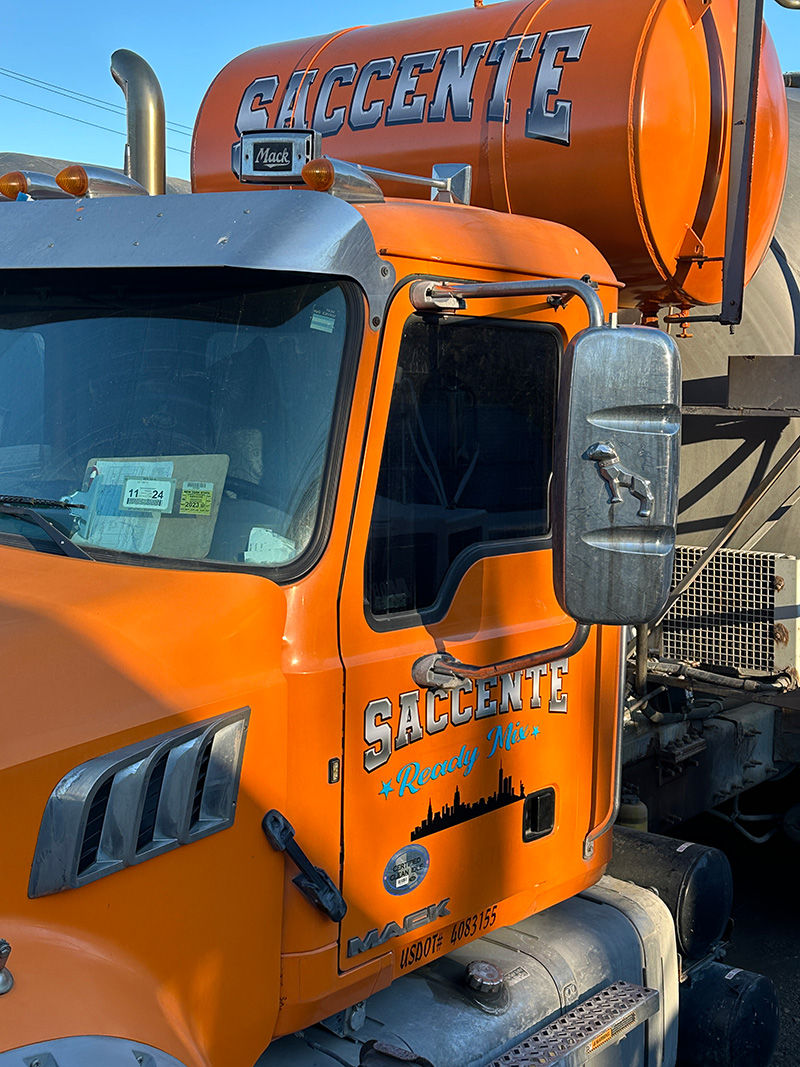 close up image of a saccete ready mix branded work truck