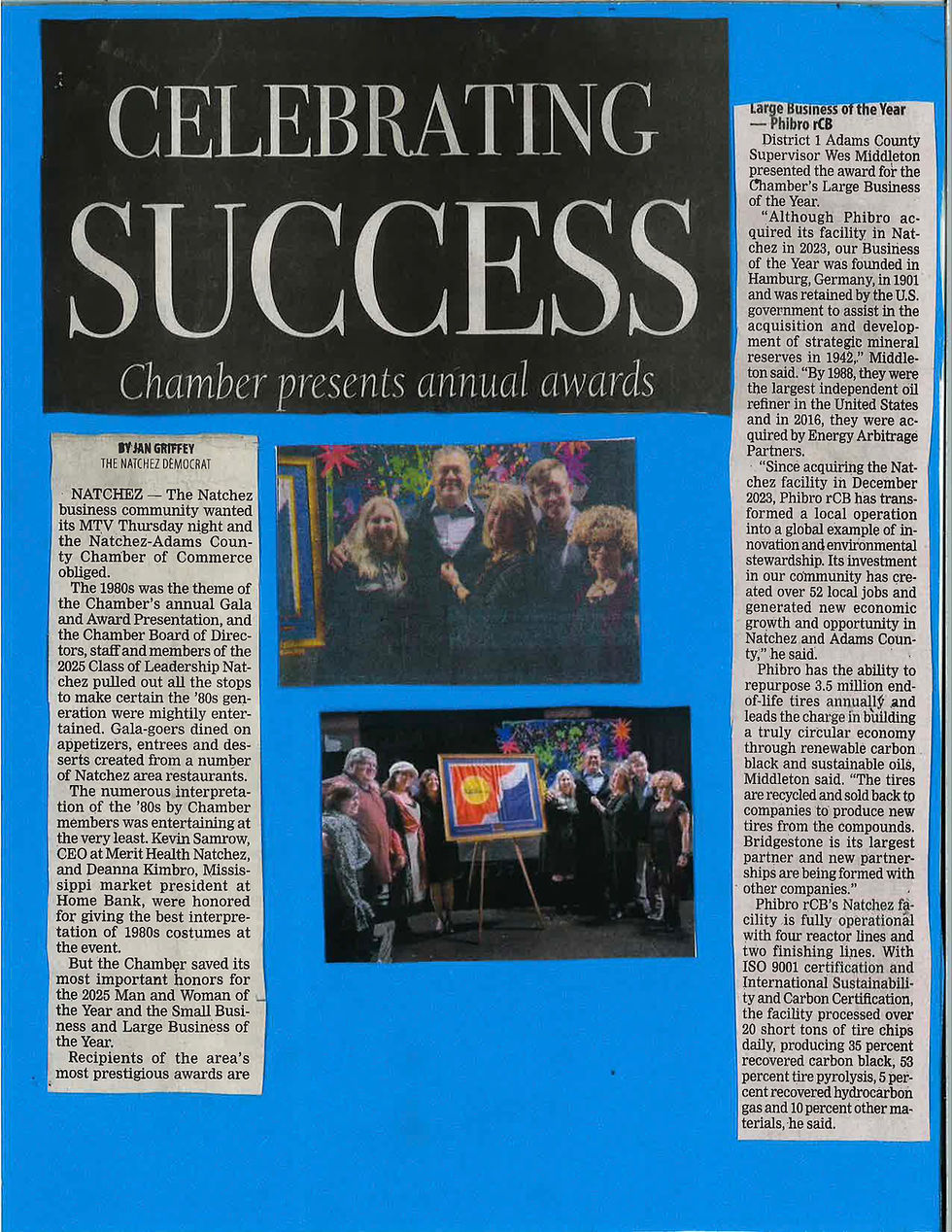 newspaper clipping highlighting phibro rcb as large business of the year at natchez-adams chamber awards with group photo and artwork presentation