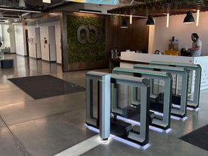 optical turnstiles installed at a commercial office entrance for secure access control and visitor management
