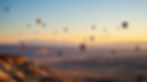 give me an website background of kanab utah with hot air ballons floating up.jpg