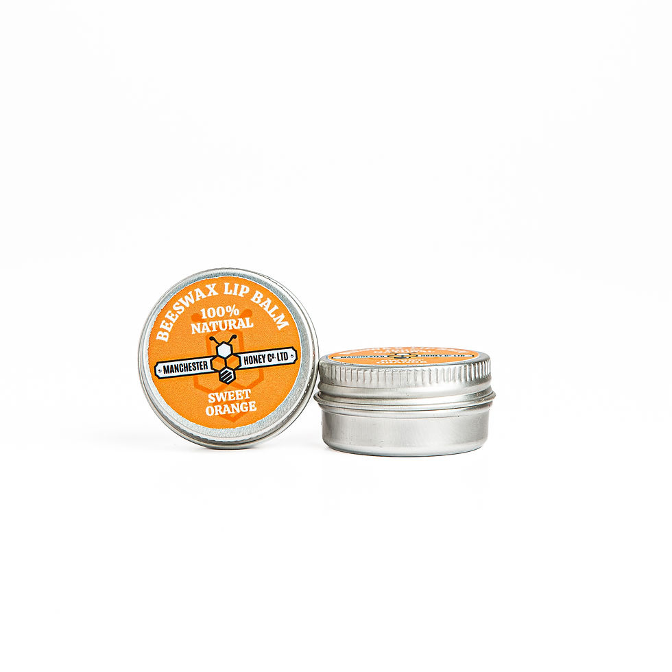 10ml Sweet Orange Lip Balm by Manchester Honey Co. Handcrafted with local beeswax and uplifting essential oil.