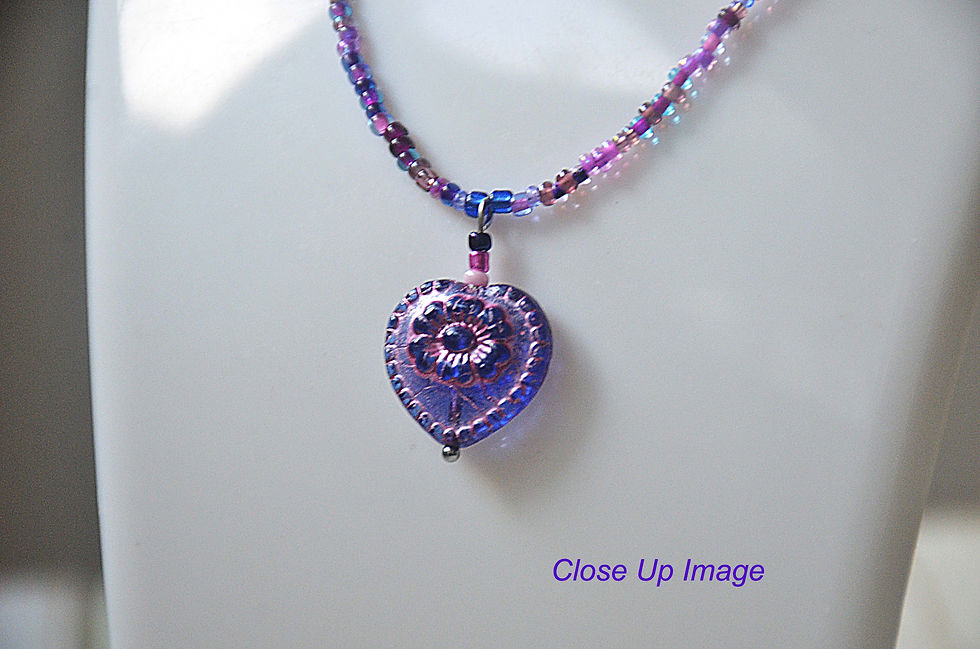 Thumbnail: Heather Shimmer Seed Bead Necklace Choker with Heart Shape Floral Glass Pendant