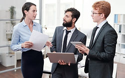 business-team-in-office-e1637858997834-pglcdh04tviws4163wd5slj215m32lynl4xe4wlhfs.jpg