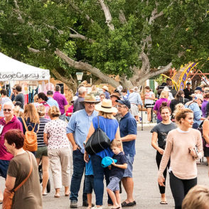Market Stalls and people at the Tree of Knowledge Family Fun Day