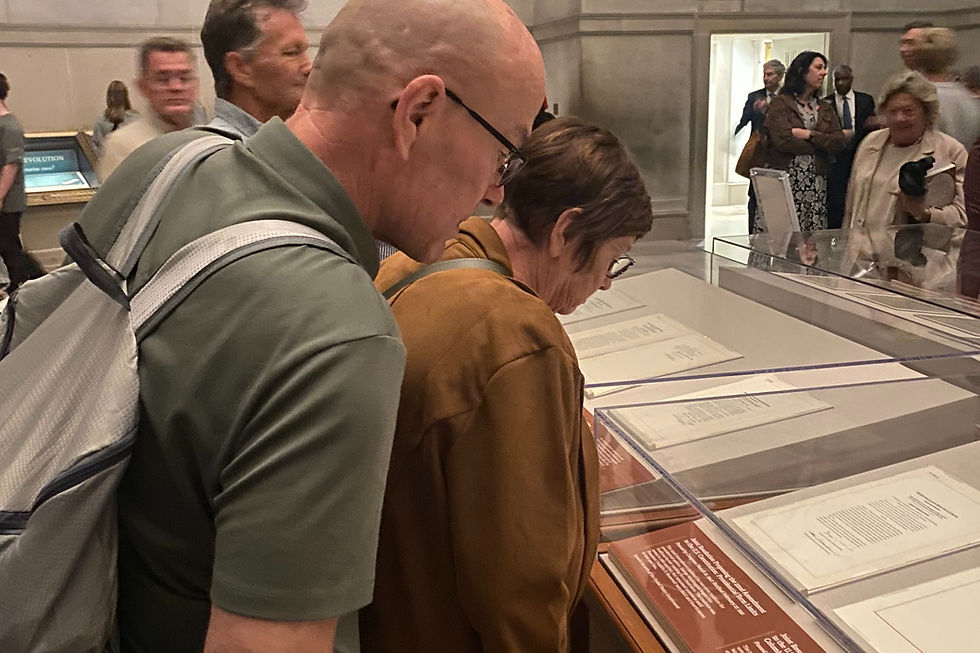 Guests looking at the Constitutional Amendments on display at the National Archives.