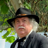Picture of Dr. Brian R. Rucker - Dr. Brian R. Rucker is one of the featured speakers during the year for the Bagdad Museum Lecture Series held each month at the Historic Bagdad Village Museum. Dr. Rucker has written numerous works including topics on the Civil War and its local impact. Dr. Rucker's new book, Mine Eyes Have Seen, widens our vision of Civil War in the Panhandle of Florida from the Pensacola Bay area eastward to Chattahoochee. The book was inspired by Dr. Rucker's fascination with stories from Florida's newspaper clips from the late 1800s to early 1900s.