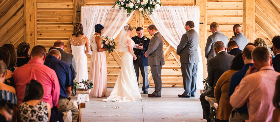 couple stands together at Alturia Farm for their ceremony