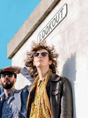 3-Men Rock and Roll band from Dorset, posing on a sunny day.