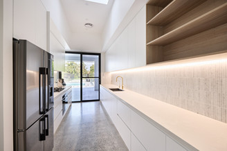 Galley kitchen design Caesarstone Cloudburst Concrete, Polytec Maison Oak.