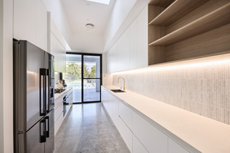 Galley kitchen design Caesarstone Cloudburst Concrete, Polytec Maison Oak. 