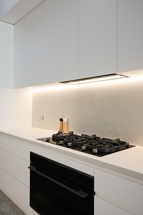 Galley kitchen design Caesarstone Cloudburst Concrete benchtop & backsplash.