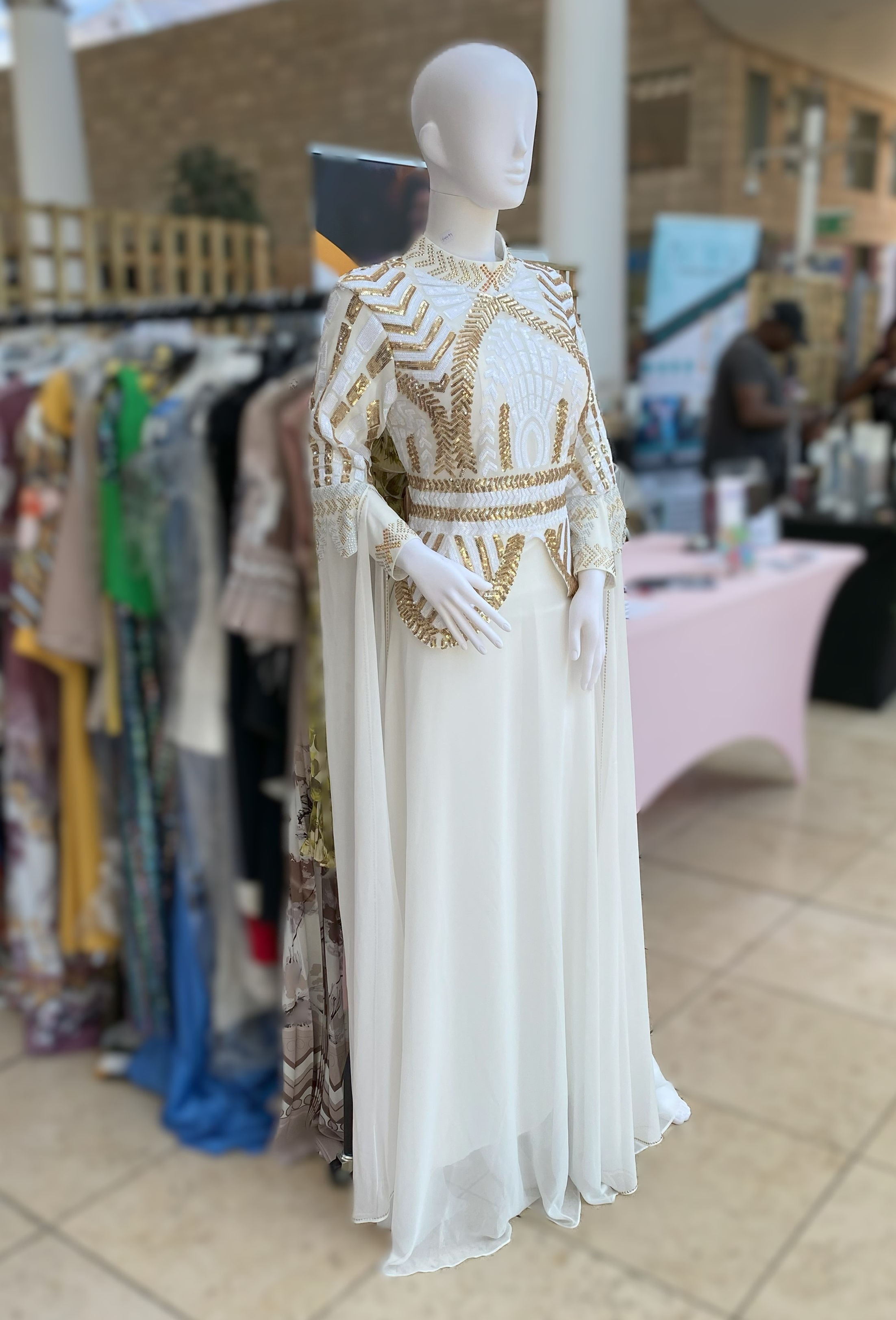 White dress with Gold design and wings