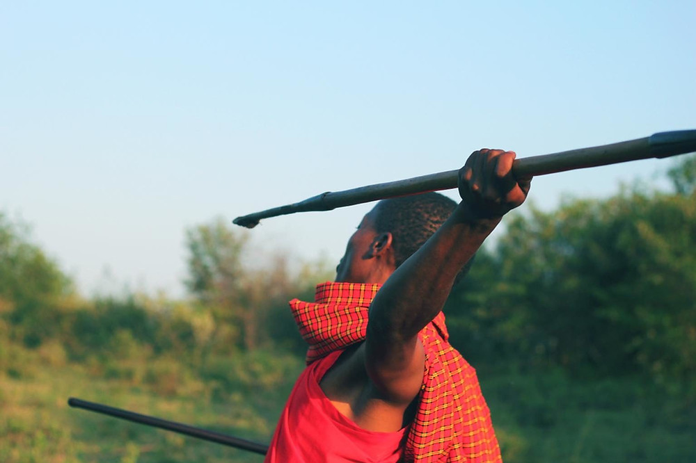 man throwing spear