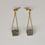 Thumbnail: Gold cement and foliage dangling earrings
