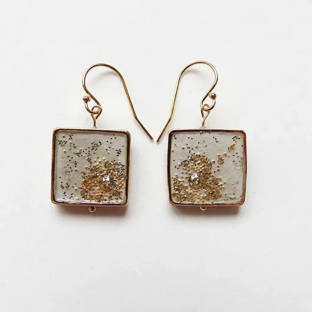 Boucles d'oreilles pendantes Comète dorée