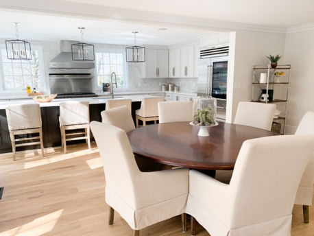 Kitchen with a seating area, island and stove.