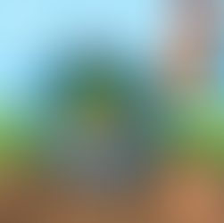 A cartoon hand holding a magnifying glass that is looking at a minecraft block.