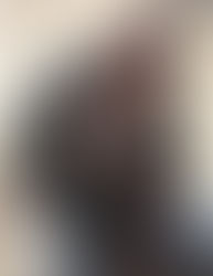 A scientist tickling a chimpanzee