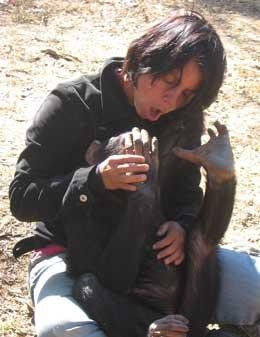 Photo of Dr. Marina Davila-Ross tickling a monkey,