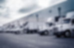 Delivering or Supply concept image. Trucks loading at facility..jpg