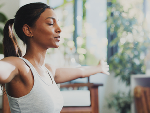 A woman doing Vegas nerve stimulation to help manage autoimmune flareups after exercise
