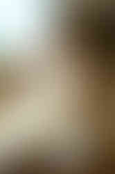 Lady sitting and posing with a notebook on the table 