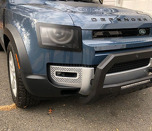 Defender 110 with custom bull bar and light covers