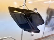 Shooting clear coat on plastic oil cover for Harley Davidson