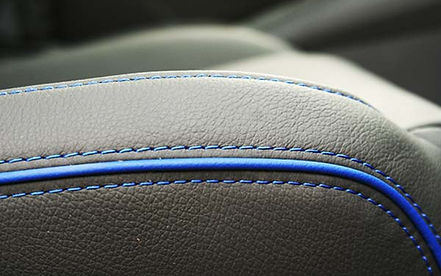 Hand-stitched leather welting detail on seats