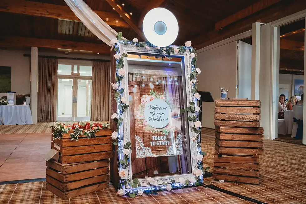 Magic Mirror at a wedding, there are roses around the mirror frame