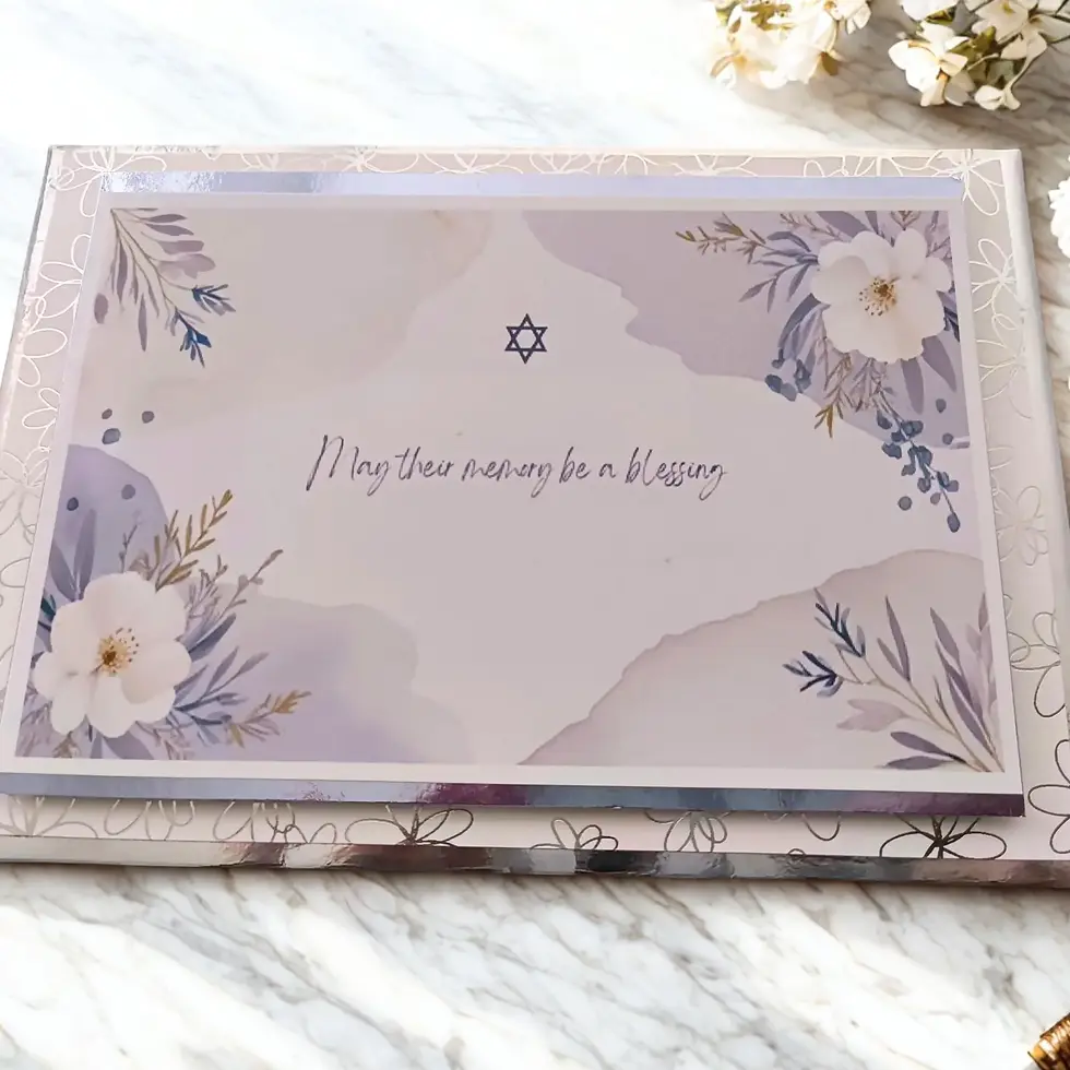 Close-up of a premium Jewish sympathy card showing the shimmering silver foil border and floral details.