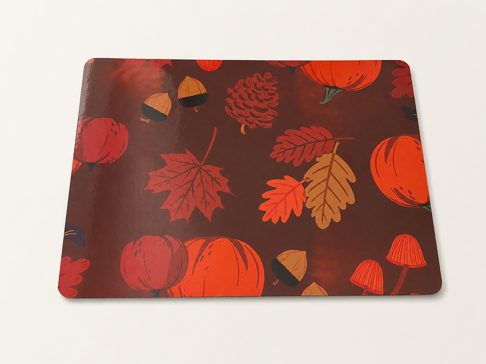 A pattern featuring autumn leaves and pumpkins set against a dark background.