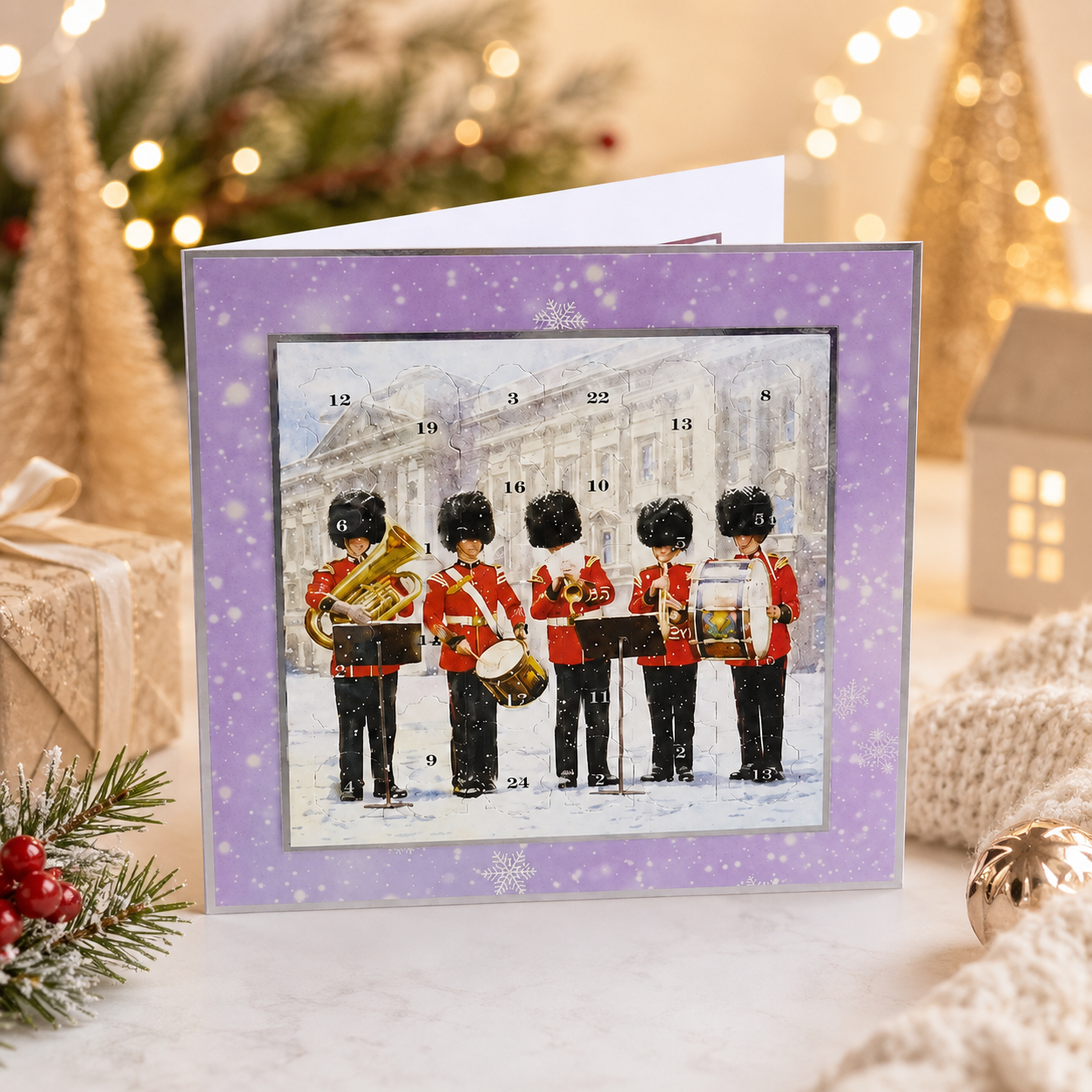A Christmas card featuring a group of men in red uniforms playing musical instruments, set against a snowy background