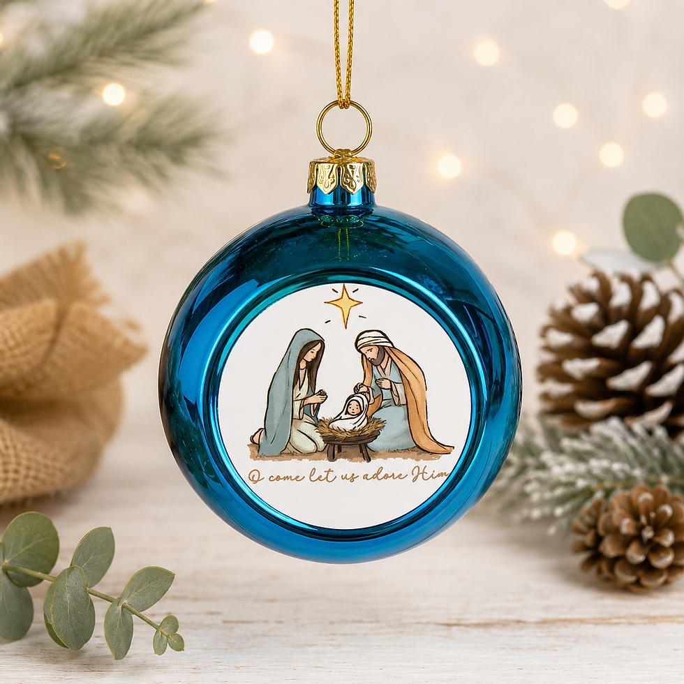 A blue Christmas ornament with a nativity scene and the text "O come let us adore Him" is displayed on a white background.