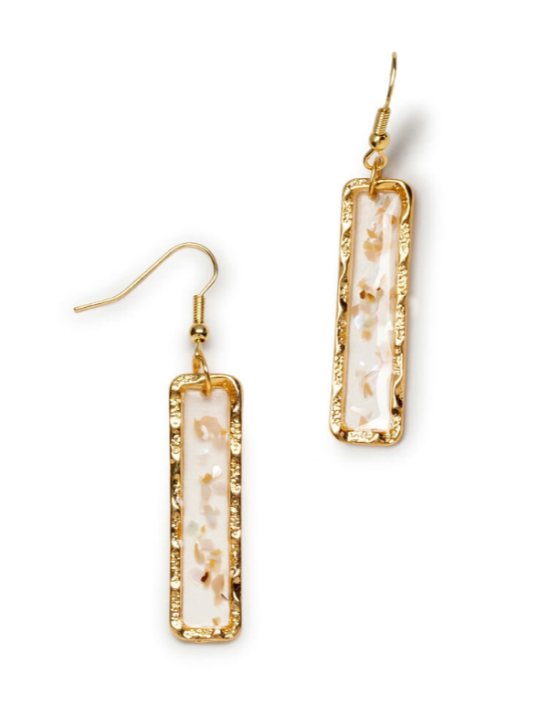 Ophelia gold tone rectangular bar drop earrings with marbled resin center on white background.
