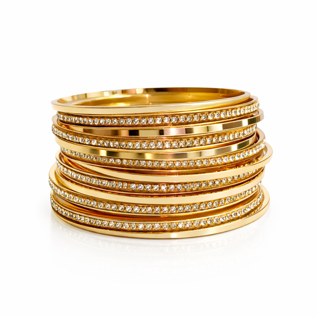 Isadora Crystal Bangle Set featuring stacked gold-tone bangles with sparkling crystal embellishments on white background.