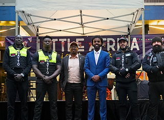 CATTO security team with guests at an outdoor community event