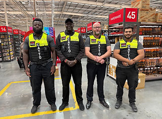 Four CATTO security guards providing retail security services inside Panda Mart