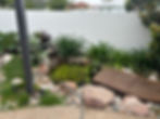 Rock and garden landscaping including running pond in sunshine coast qld