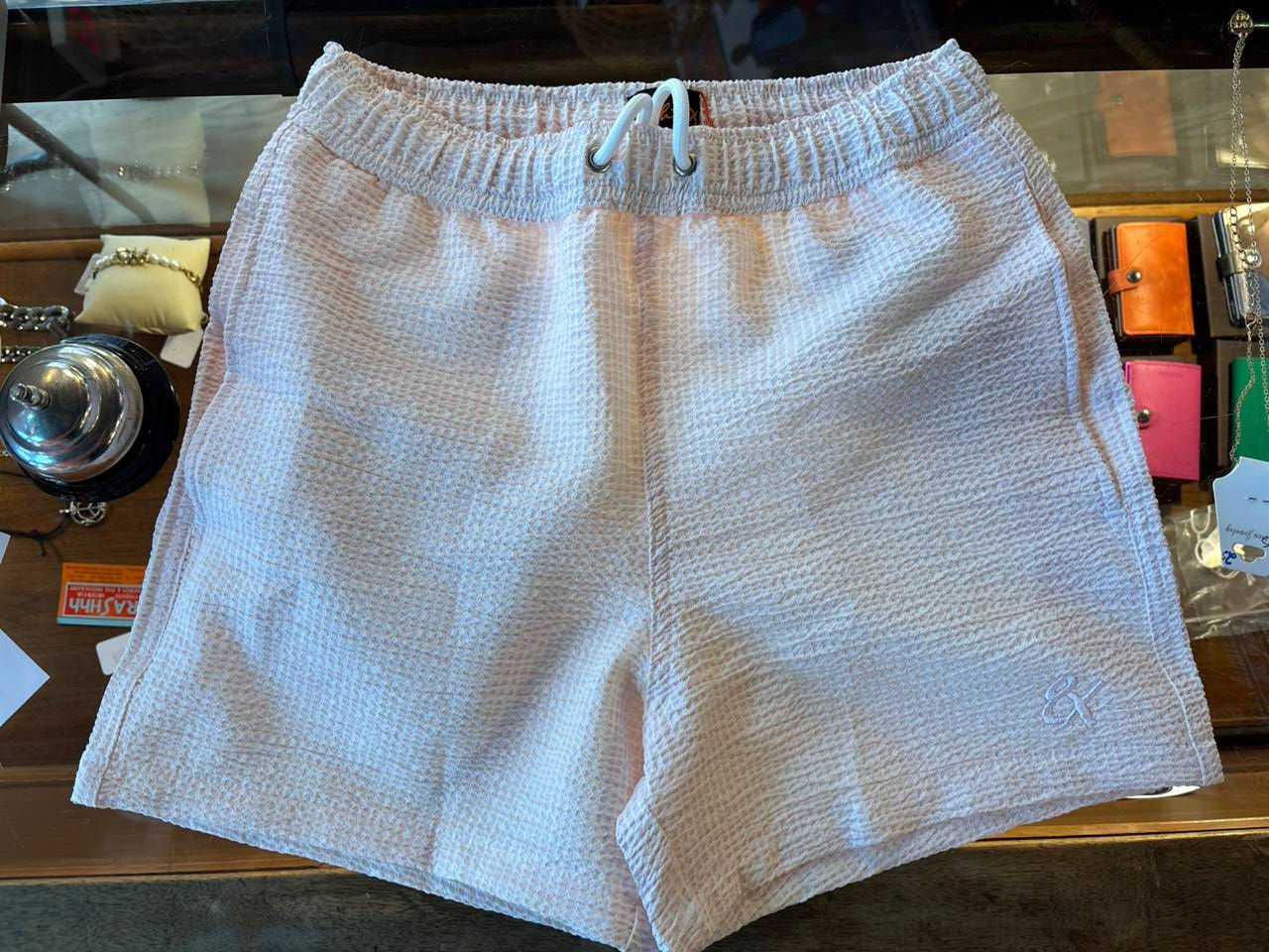 Pink colored Eight-X swim trunks