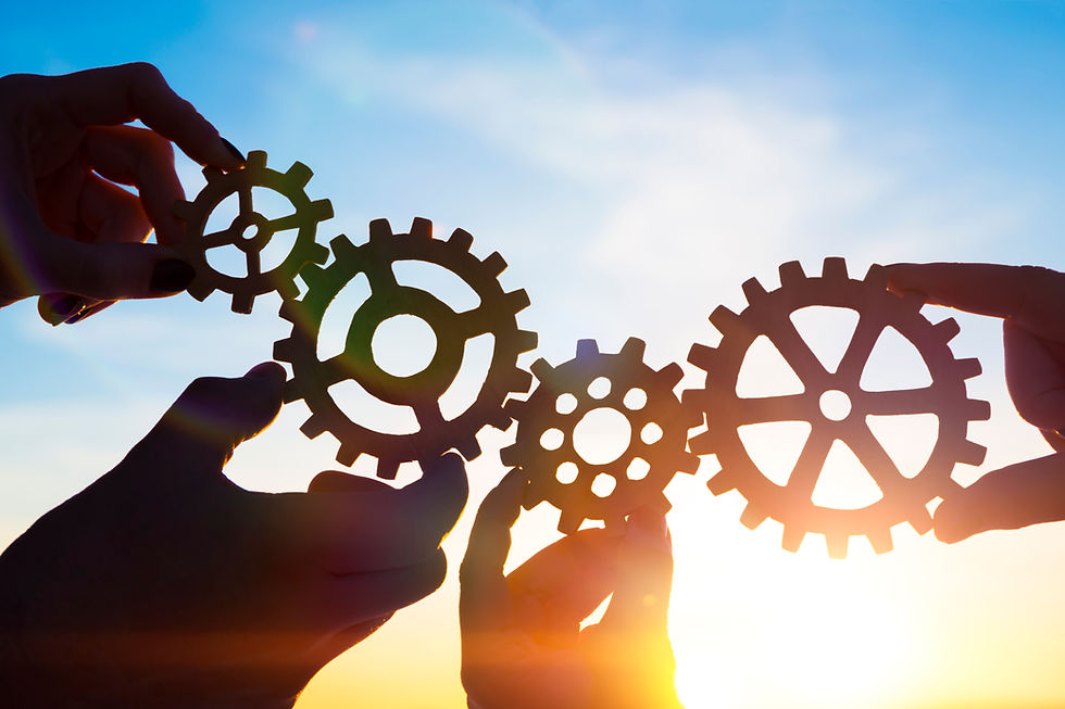 Four hands of businessmen collect gear from the gears of the details of puzzles
