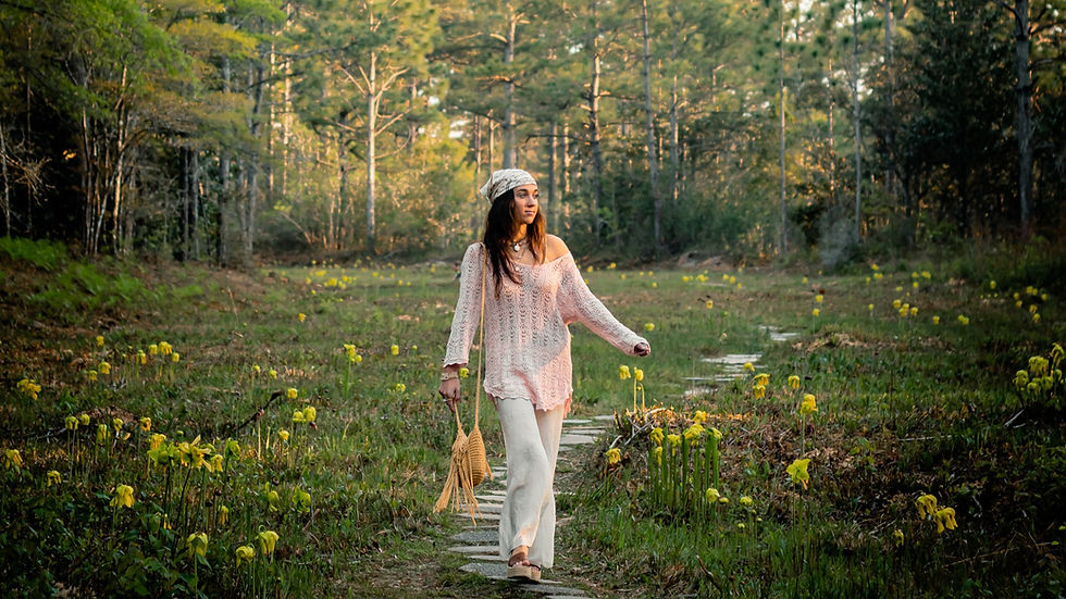 A girl strolls through a sunlit field, surrounded by lush greenery and yellow blooms, embodying a serene and carefree spirit.
