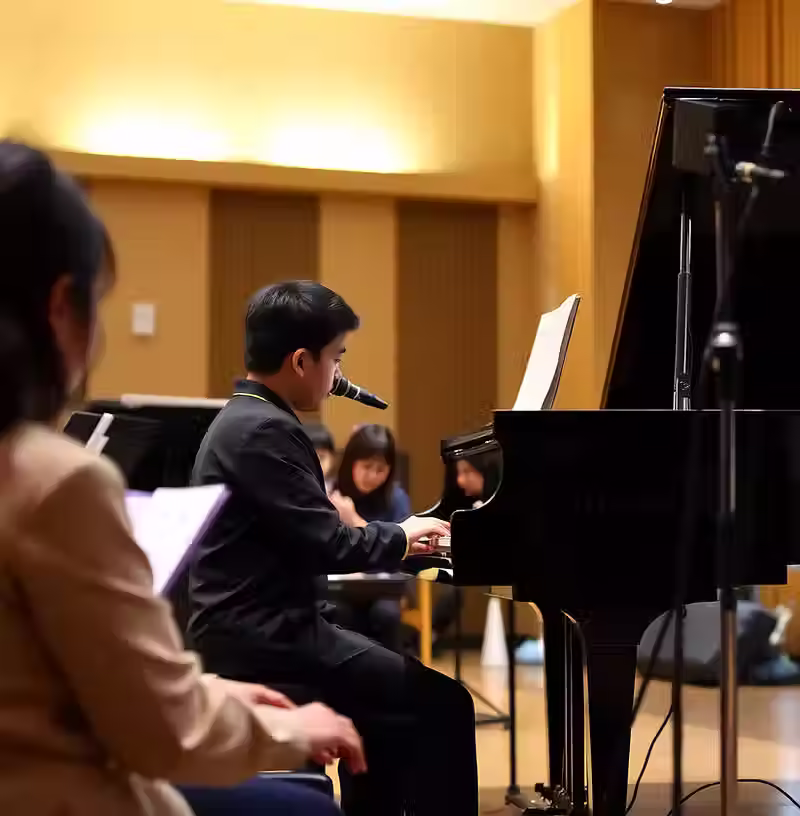 Student performing inside the Asia Music School recital ha.avif
